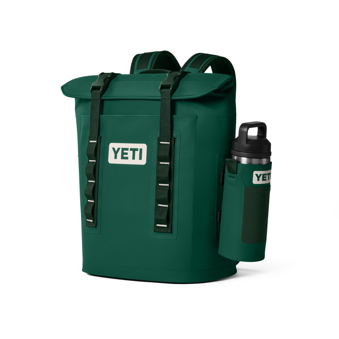 YETI Black Forest Collection cooler bag in deep forest green. Durable, weather-resistant, and designed for camping, fishing, road trips, and outdoor adventures. Keeps drinks cold and gear dry with YETI’s signature rugged construction. Available at The County Emporium, a leading Canadian YETI retailer.”