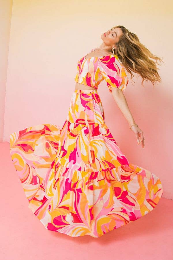 Hottest trending fashion multi colour maxi skirt bright pink orange soft yellow pink. Wear it long or pull it up belt and flounce for a midi strapless dress.  model is wearing with a matching top spinning. The skirt has excellent spin capabilities.
