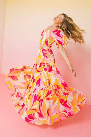 ￼Hottest trending fashion multi colour maxi skirt bright pink orange soft yellow pink. Wear it long or pull it up belt and flounce for a midi strapless dress. ￼ model is wearing with a matching top spinning. The skirt has excellent spin capabilities. 