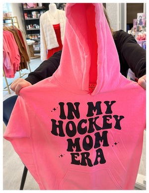 Hockey mom sweatshirt in my hockey, mom era, neon, pink, hooded sizes, extra small to 3XL designed and made in Canada sold in Canada ￼shop local support local.  