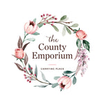The county emporium carrying place soft floral wreath simple soft sage and blush tiny red berries and purple lilac done in watercolour 