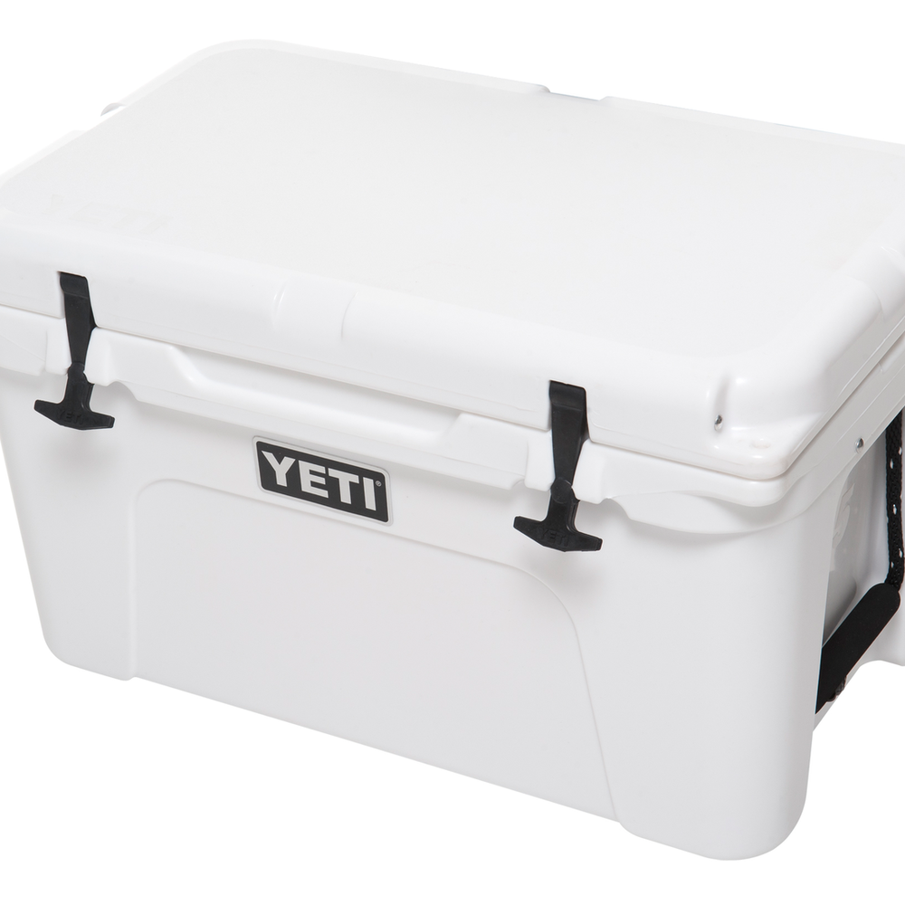 YETI hard cooler tundra 45 front view white background white cooler shown closed black latches, black handles, black YETI sticker