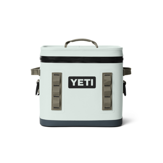 A YETI hopper insulated cooler  bag in ridgeline green color with a black bottom base, black zipper, and gray handles, shown on a solid white background.