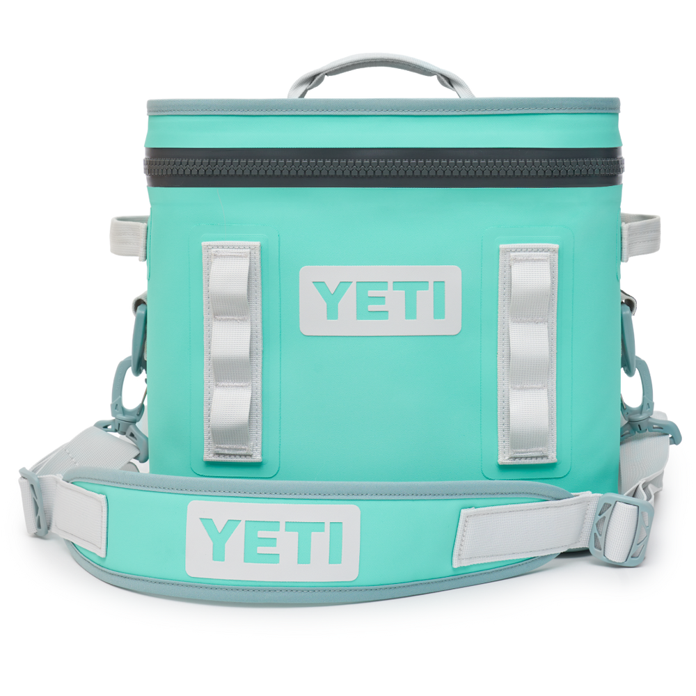 YETI Hopper Flip 12 soft cooler in aquifier blue with zippered top, carry strap and accessory loops