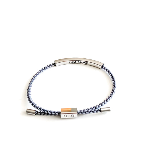 Glass House Goods Our Girls braided bracelet "I am brave" in grey