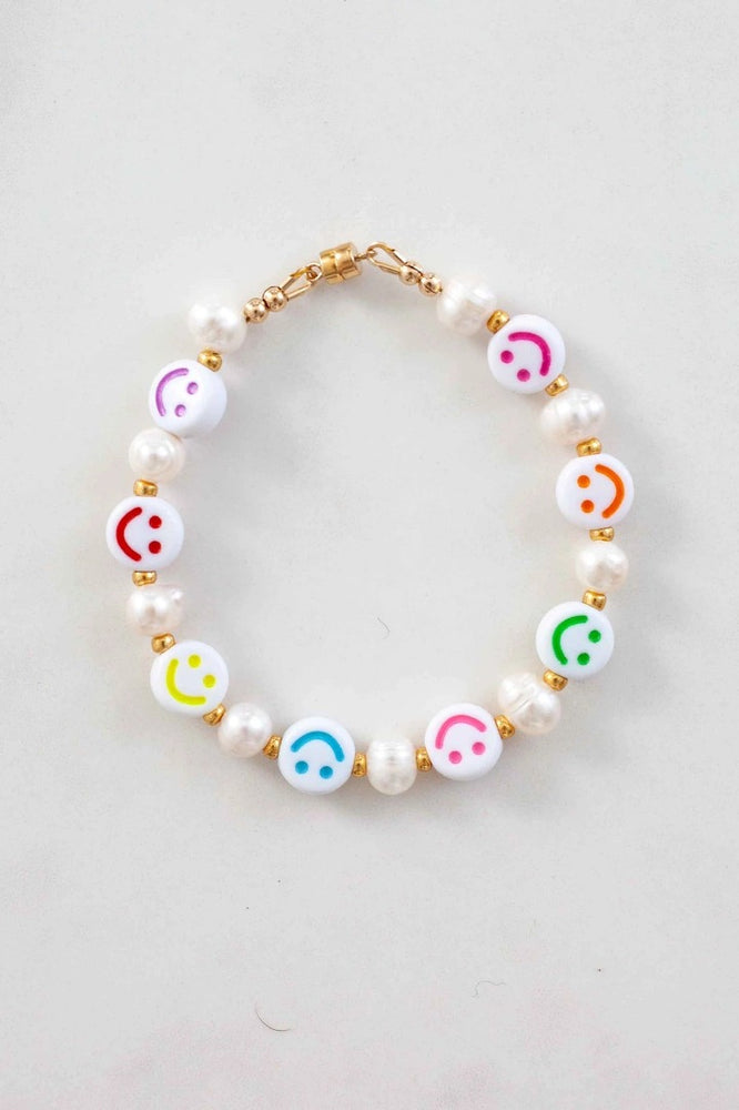 Minted mama amilia bracelet made with freshwater pearl smiley faces and 14kt gold pieces and magnetic clasp