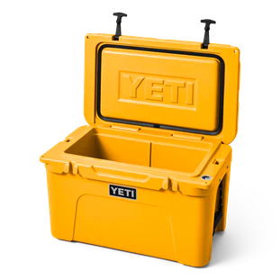 YETI hard cooler tundra 45 front view white background shown open YETI logo engraved inside top lid, alpine yellow